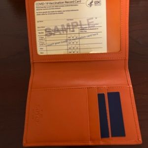 Royce leather Passport Holder.  New in box orange. Includes gift box.